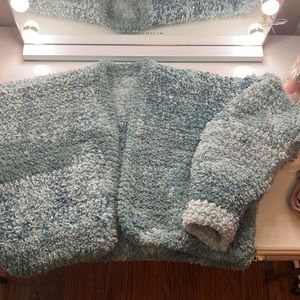 Teal knitted cropped sweater. Fits sized medium-large.